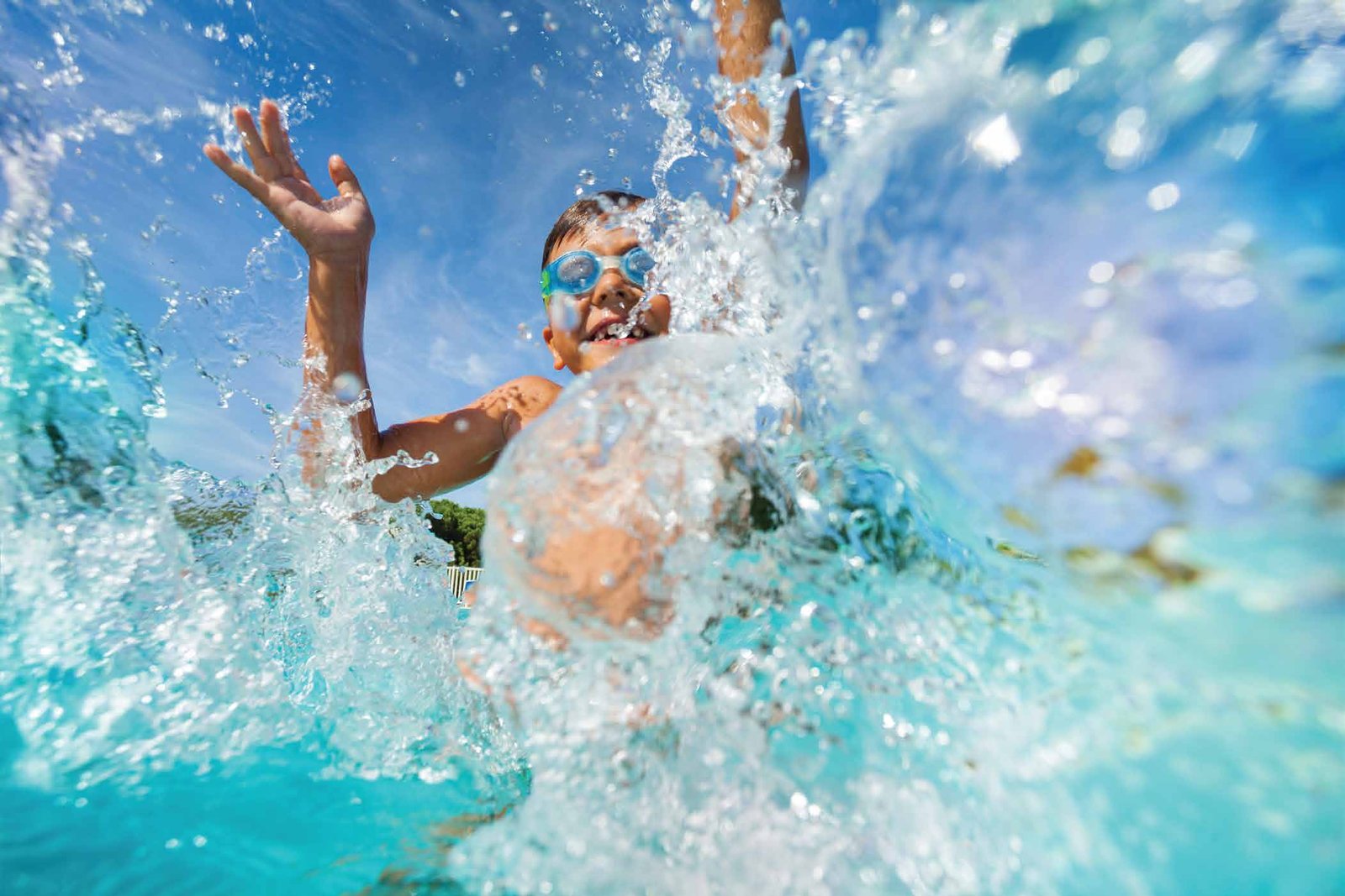 A child swimming in the kids pool